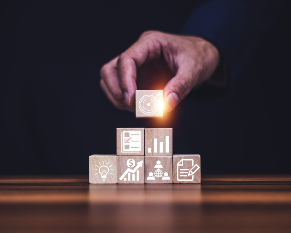 hand-touching-target-board-which-printing-wooden-cube-block-concept-business-plan-performance-achievement